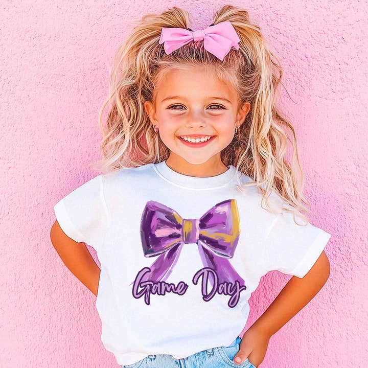 Kids Purple Game Day Bow T-Shirt for wholesale by Under The Lights Designs
