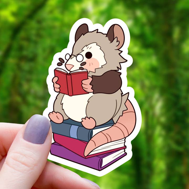 Reading Opossum Sticker - 3" for wholesale by Mimic Gaming Co
