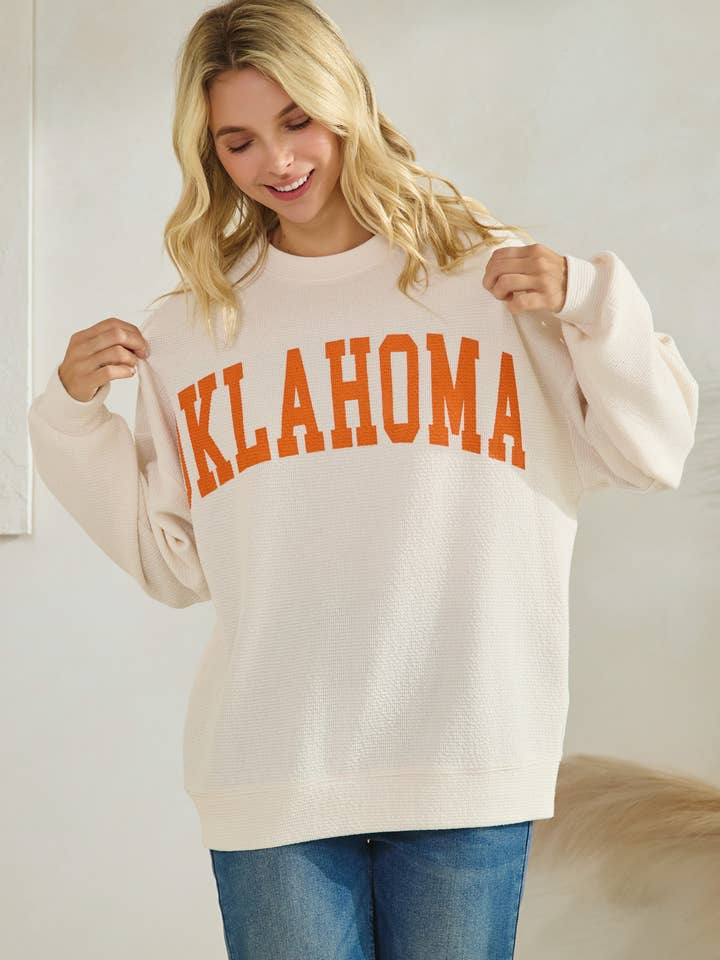 T-42113-CREAM/ORANGE OKLAHOMA SWEATSHIRT for wholesale by Tres Bien, Inc