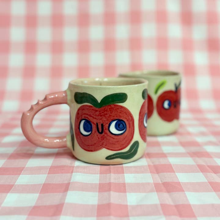 Bitten Apple - Ceramic Mug for wholesale by Rosi Tooth