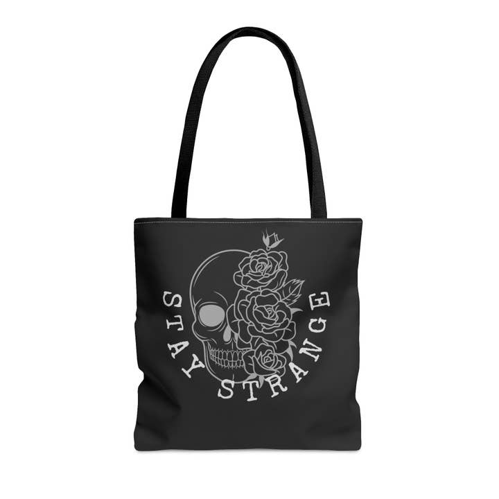 Stay Strange Floral Skull Black Tote Bag for wholesale by Studio Renly