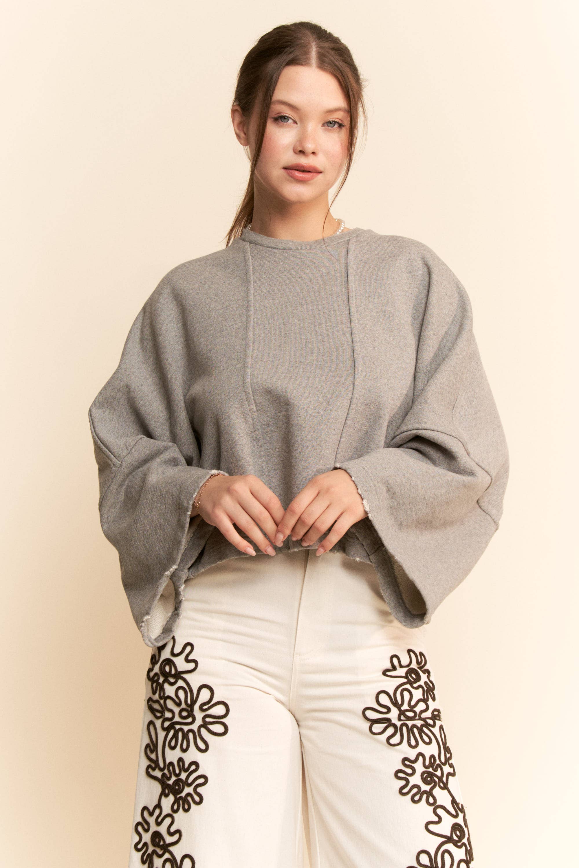 Heather Grey OVERSIZED BELL-SLEEVE RAW HEM SWEATSHIRT for wholesale on Faire2