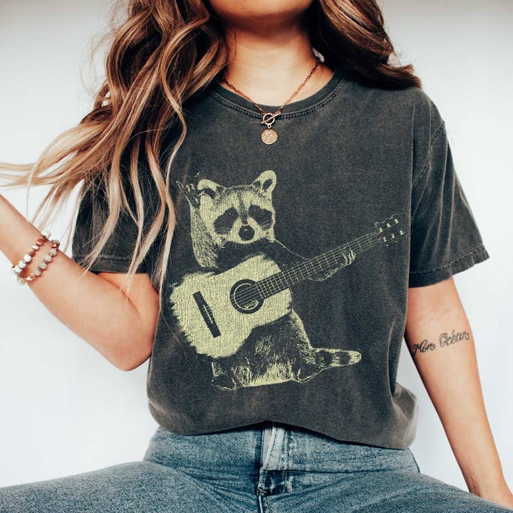 Raccoon Playing Guitar Music T-Shirt and other Purchase Wholesale guitarras clásicas. Free Returns & Net 60 Terms on Faire trending on Faire.