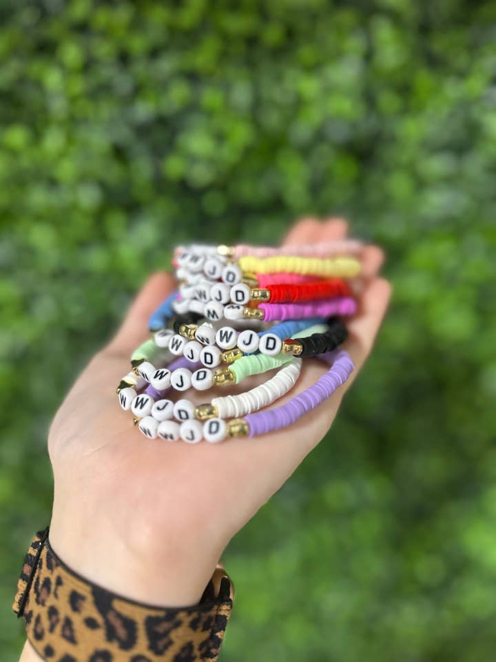 WWJD Clay Bracelet and other Purchase Wholesale stacked. Free Returns & Net 60 Terms on Faire trending on Faire.