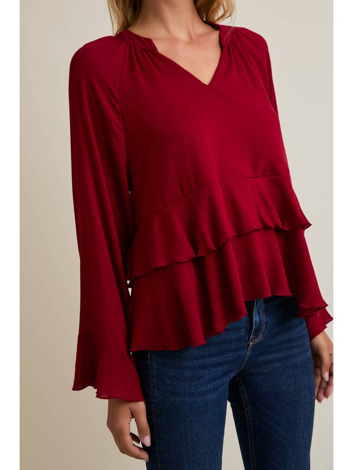 RUBIS Haut à manches longues avec encolure en V et ourlet à volants en vente sur Faire4