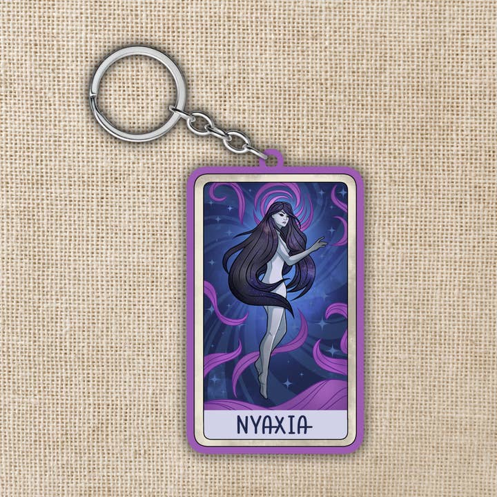 Goddess Nyaxia Keychain | Crowns Of Nyaxia for wholesale by Kingdom of Threads