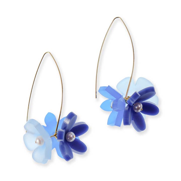 Flowerball dangly earrings in Blue for wholesale by By Chavelli