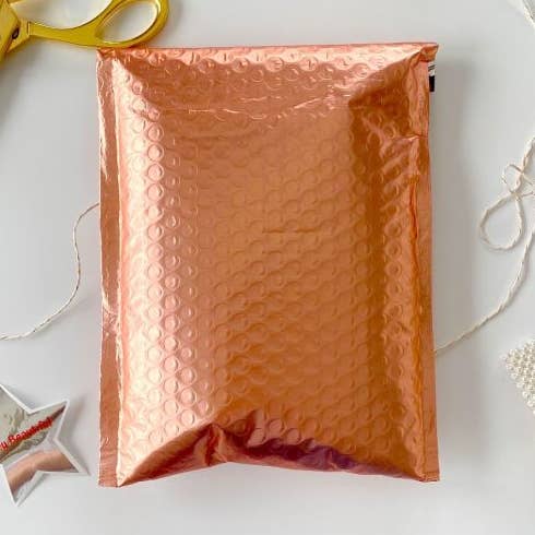 Bustine a bolle in polietilene metallizzato in oro rosa 6,5x10 per la vendita all'ingrosso da parte di Eleven Fashion