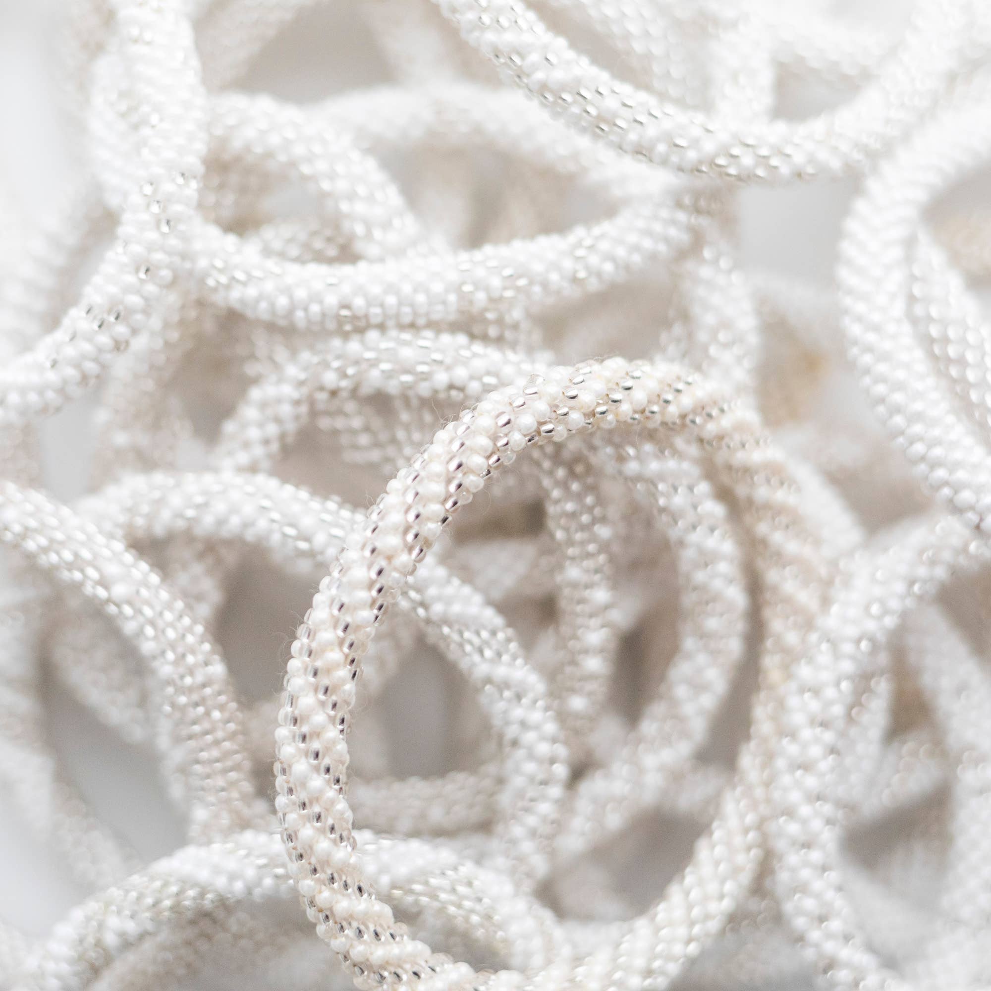 Aid Through Trade - Wholesale Jewelry Set - Roll-On® Bracelets Pearl - Set of 122