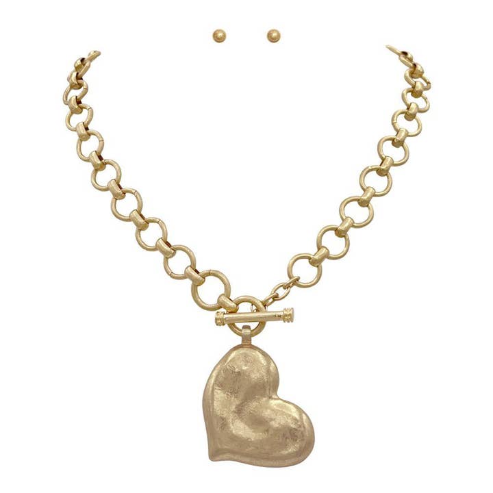 Vg HAMMERED METAL ABSTRACT HEART PENDANT CIRCLE TOGGLE NECKLACE for wholesale on Faire