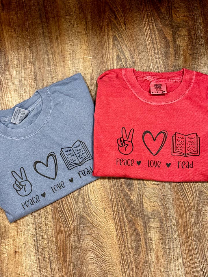 Peace Love Read Graphic T Shirt for wholesale by Wicks and Whims