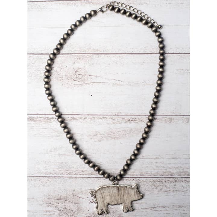 Grey RAISED IN A BARN WHITE COWHIDE SHOW PIG PENDANT NAVAJO PEARLS NECKLACE for wholesale on Faire