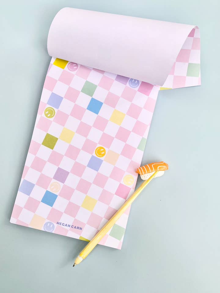 Bloco de notas quadriculado “Sorrisos e arco-íris” por atacado de Megan Carn