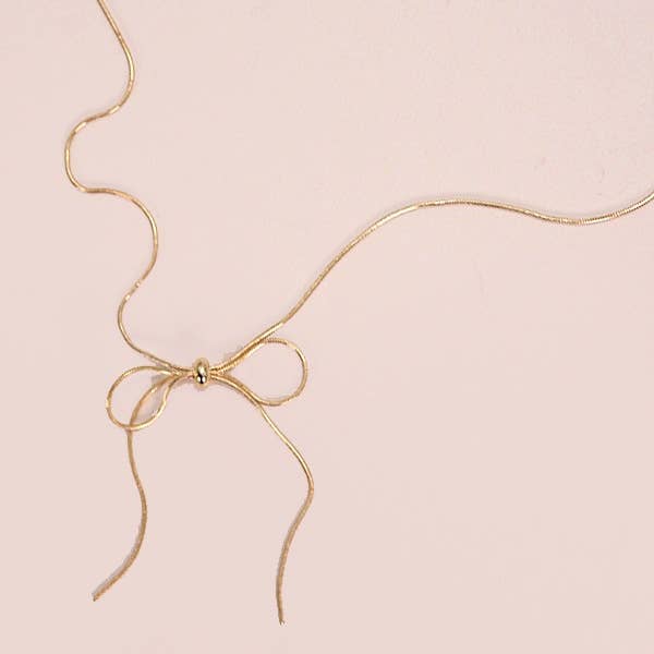 Gold SNAKE CHAIN BOW PENDANT NECKALCE | 80N815 for wholesale on Faire