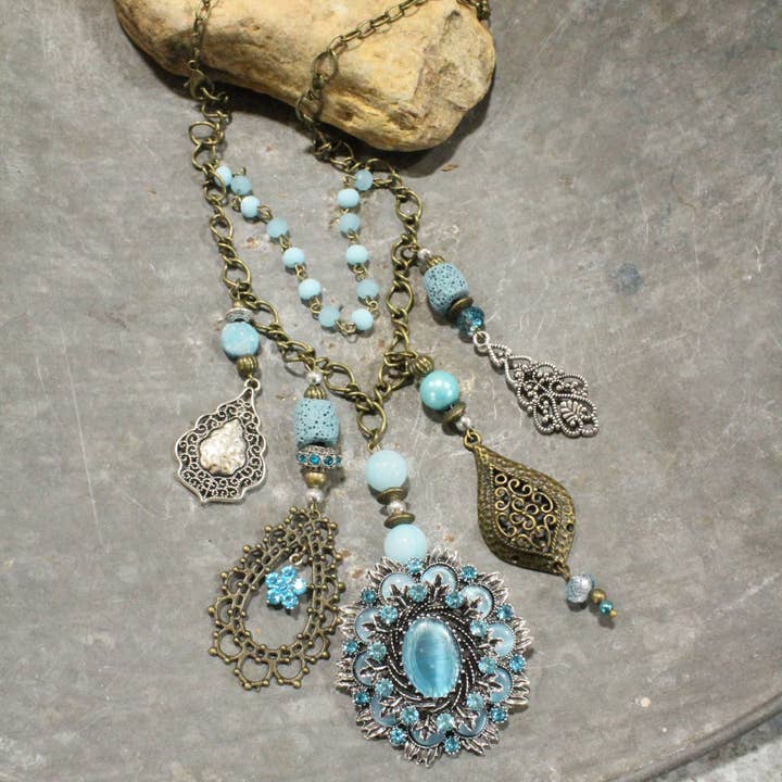 The Primitive Peddler, Inc. - Wholesale Pendant/Charm Necklace - Embellishments Of Bronze & Silver Charming Blue Pendant Layered Necklace