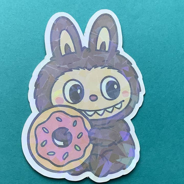 Pegatina de vinilo holográfica inspirada en el pequeño monstruo Donut para venta al por mayor de Something Personal