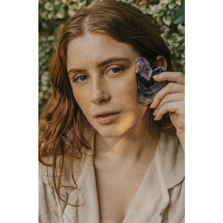 Xander Kostroma - Wholesale Gua Sha tool - Amethyst Crystal Gua Sha with Black Skull Pouch1