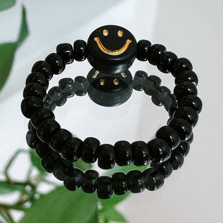 Black pearl ring with black and gold smiley for wholesale by cool people club
