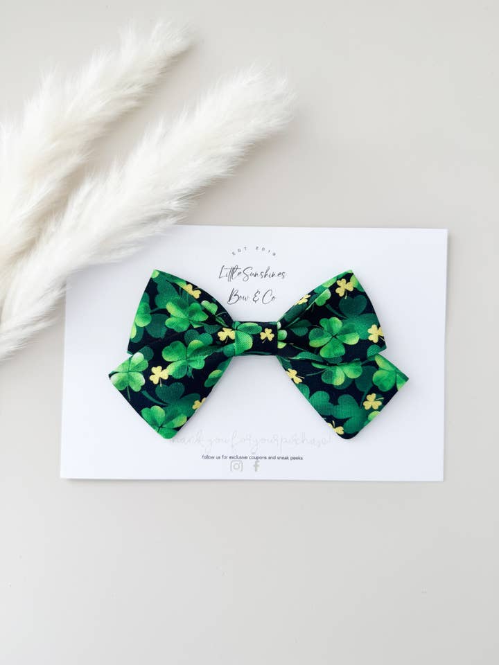 Mini Gold Clovers St Patricks Day Pinwheel Bow for wholesale by Little Sunshines Bow & Co