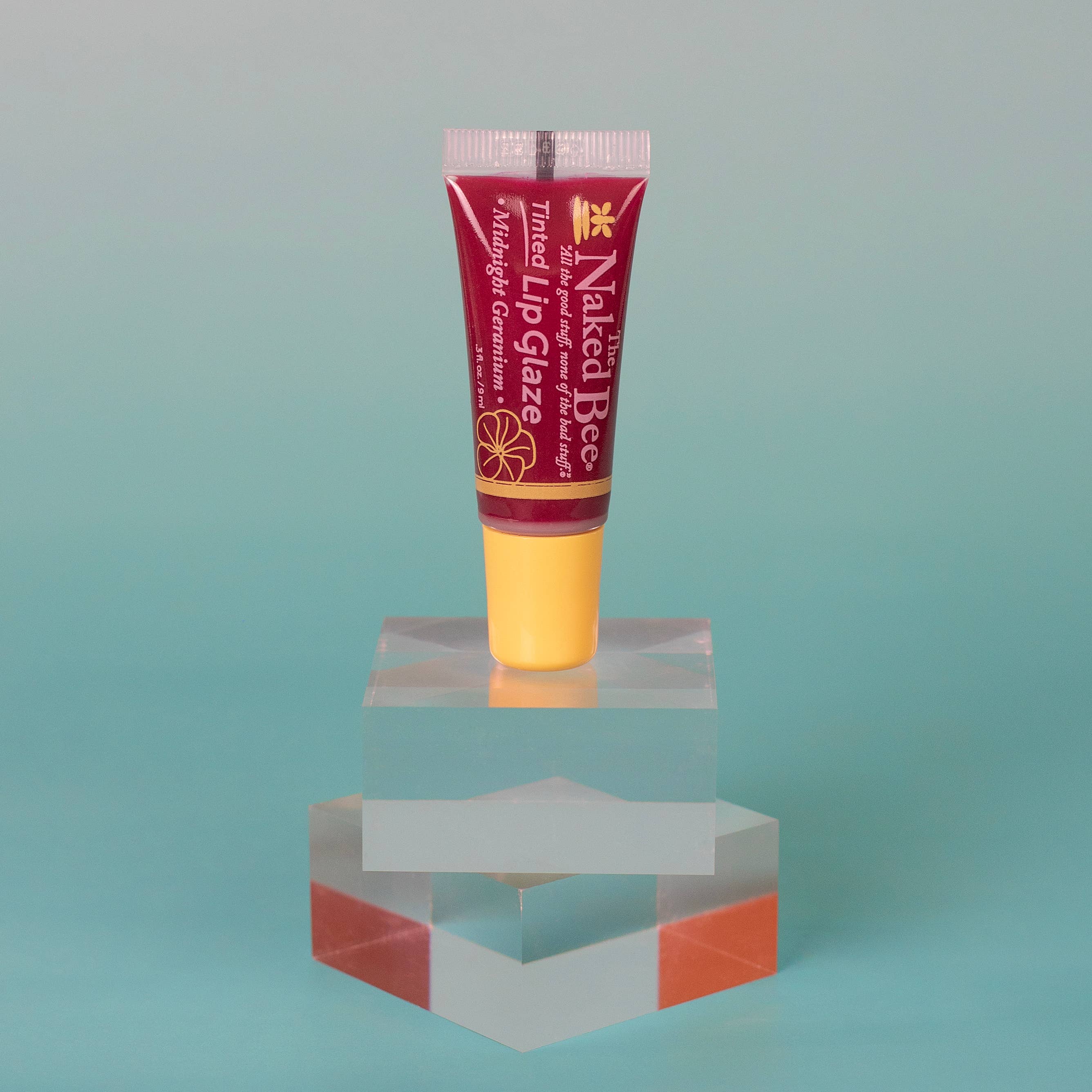 The Naked Bee - Vente Brillants à lèvres et gloss - Glaze à Lèvres Teinté Géranium de Minuit1