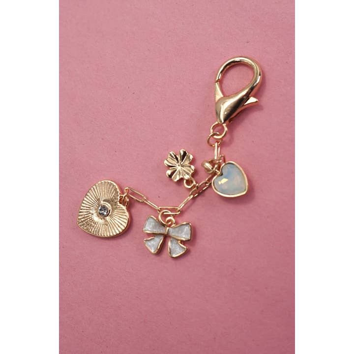 Gold HEART BOW CLOVER STONE BAG CHARM | 80K017 for wholesale on Faire2