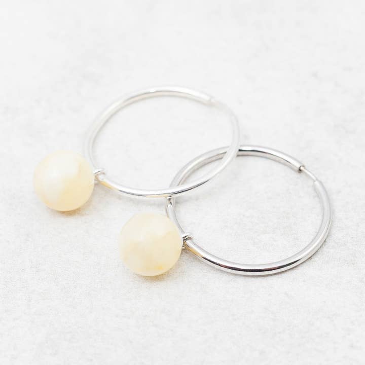 White Amber Hoop Earrings Silver Huggie Hoops Baltic Amber for wholesale by Marcin Waryszak