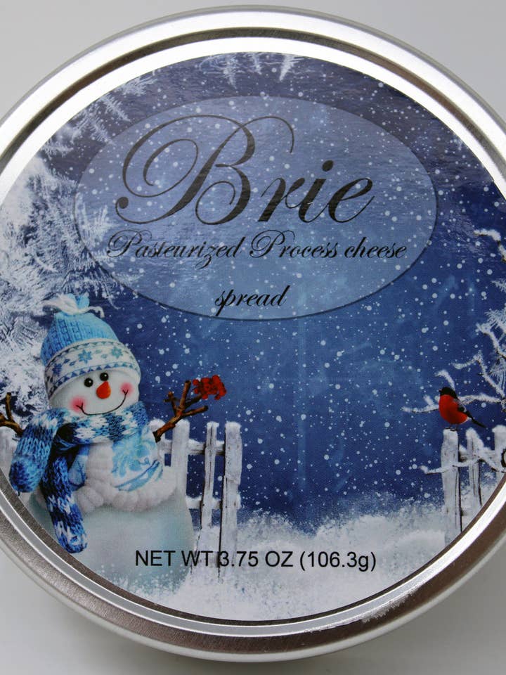 1143 3.75oz Brie Cheese Spread in a Snowman Metal Tin for wholesale by Northwoods Food and Gift Enterprises