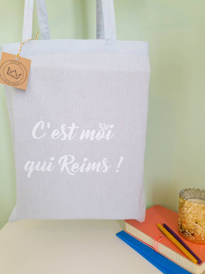 Tote bag “It's me who Reims!” sky blue for wholesale by Sacré Rémois