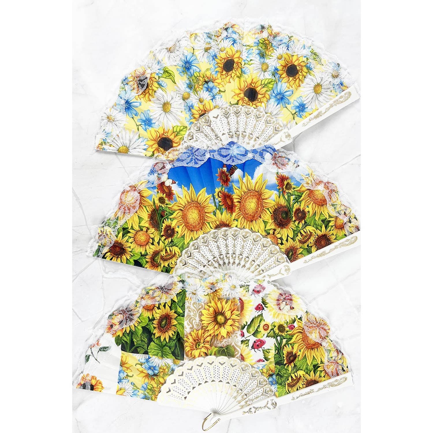 ASSORTED SUN FLOWER PRINT HAND HELD PLASTIC FOLDING FAN for wholesale on Faire1