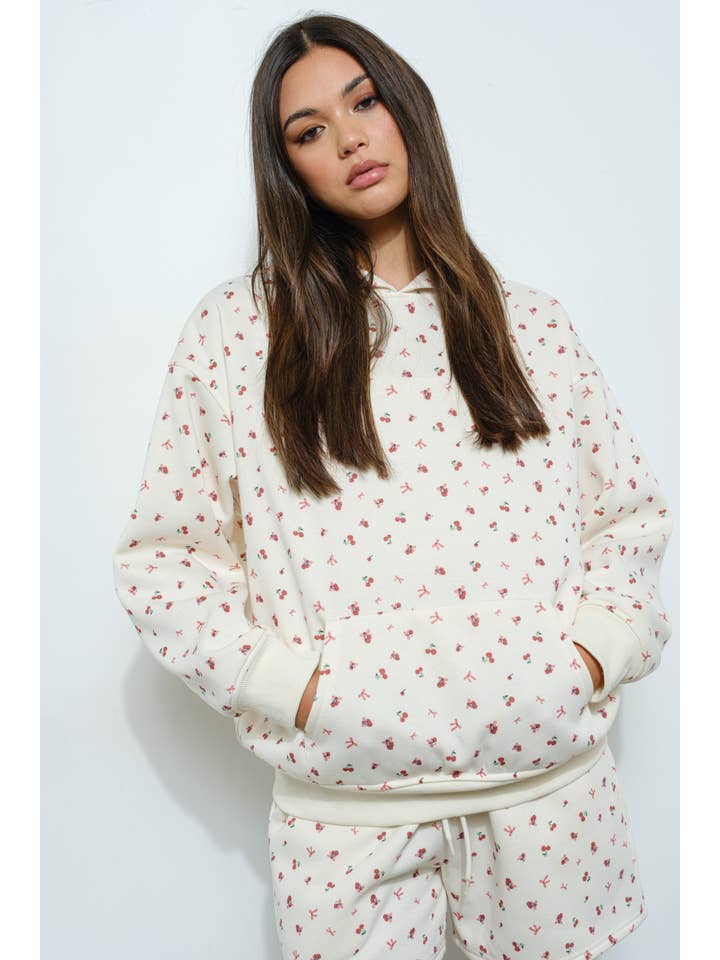 Ivory CHERRY BOW PRINT SWEATSHIRT for wholesale on Faire