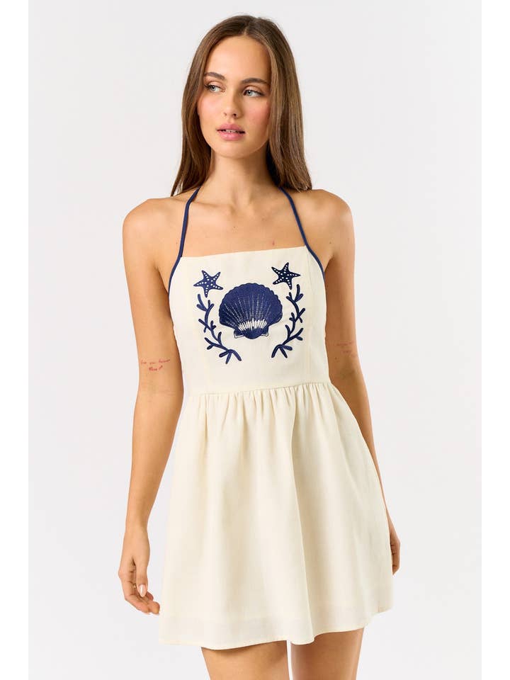 OFF WHITE NAVY IBD33506 LINEN SEASHELL EMBROIDERY HALTER MINI DRESS for wholesale on Faire