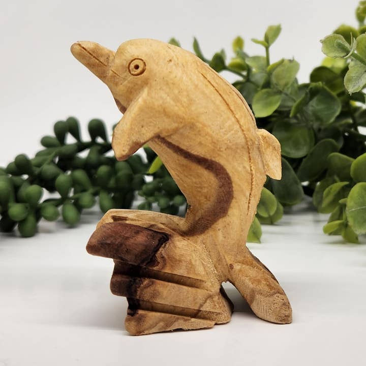 Palo Santo Hand Carved Dolphin Figurines 1.1 x 2.3 x 3.1" for wholesale by Meraki Gemstones