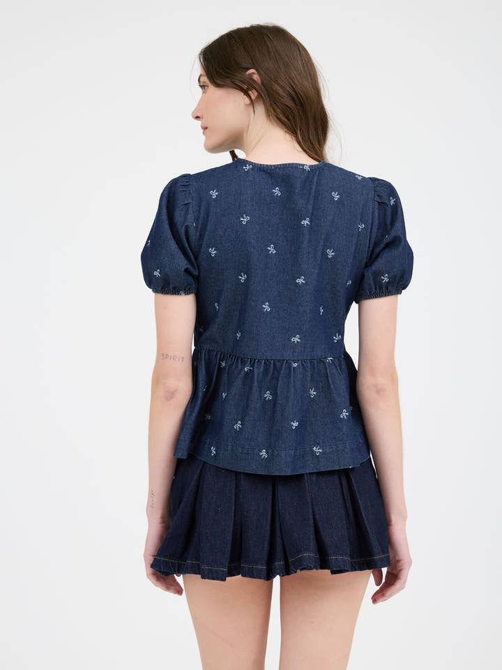 DENIM BOW PRINT PUFF SLEEVE FRONT SELF TIE RUFFLE HEM BLOUSE-BACKO for wholesale on Faire