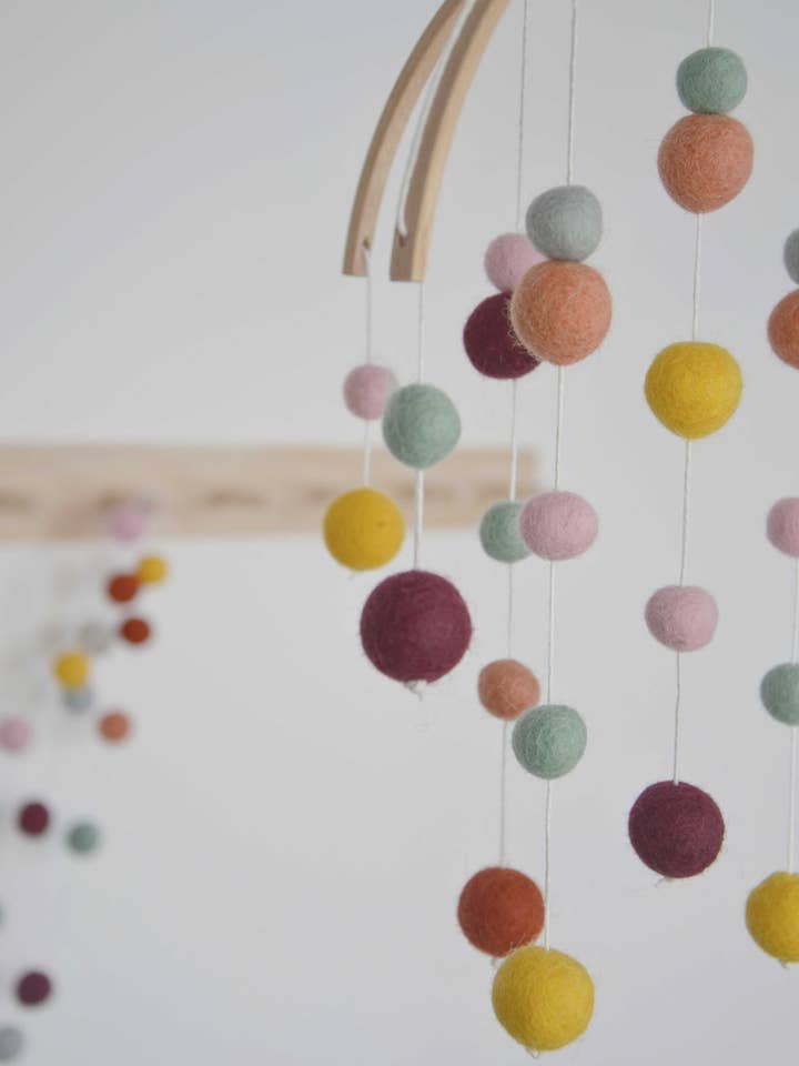 Decorative mobile in felted wool for wholesale by Calmfordreamers