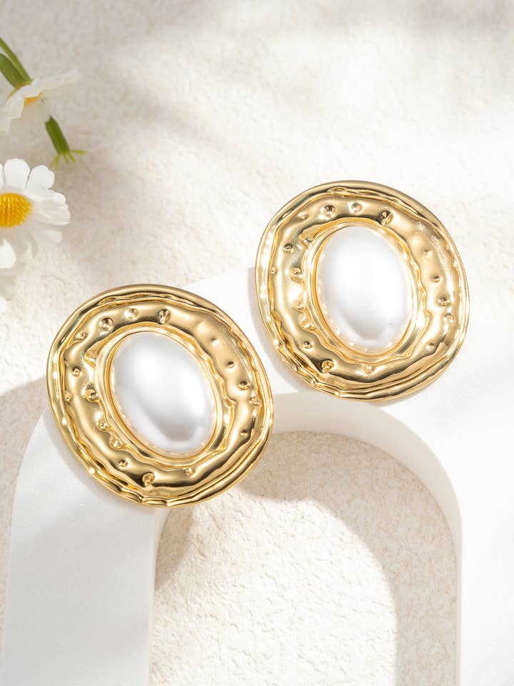 Oval pearl earrings with vintage chic textured frame for wholesale by COSMOS