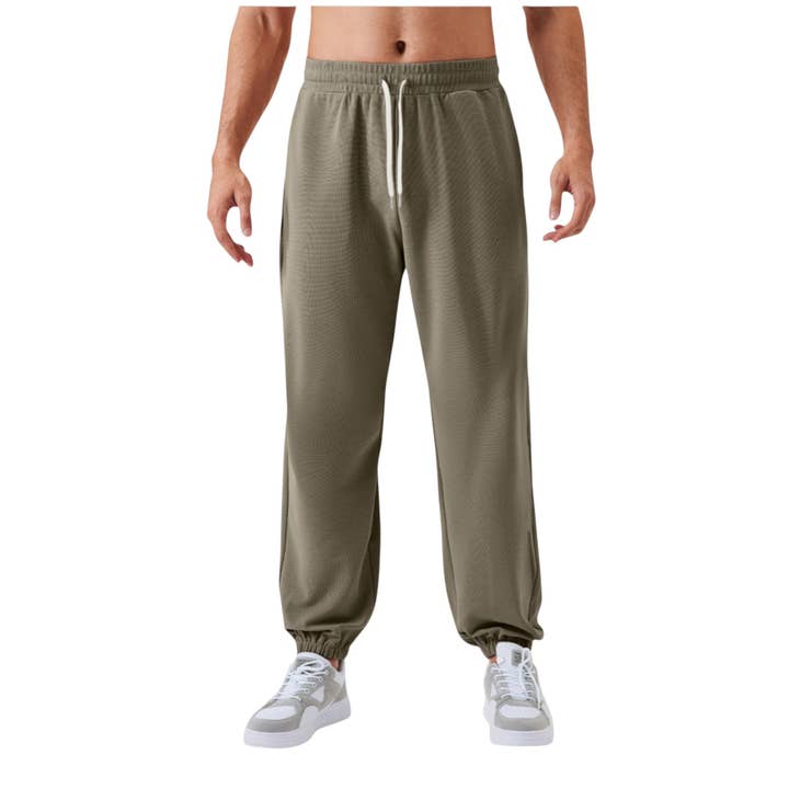 Pantalon de jogging pour hommes avec taille à cordon de serrage et chevilles élastiques. pour la vente par Active by Anna-Kaci