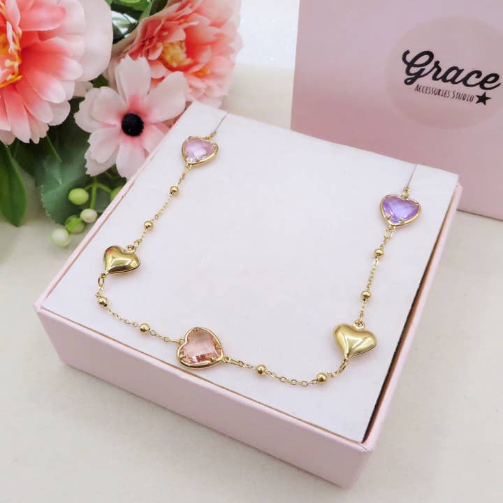 ROSALIE Collana girocollo con cuori bombè e in cubic zirconia IN ACCIAIO INOSSIDABILE per la vendita all'ingrosso da parte di Daemon srls