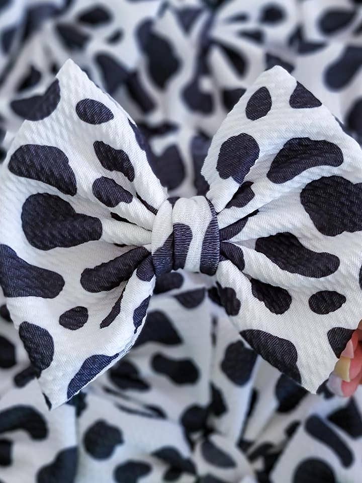 Savannah Bow - Zwart-witte koe voor wholesale door Dainty Delights Creations
