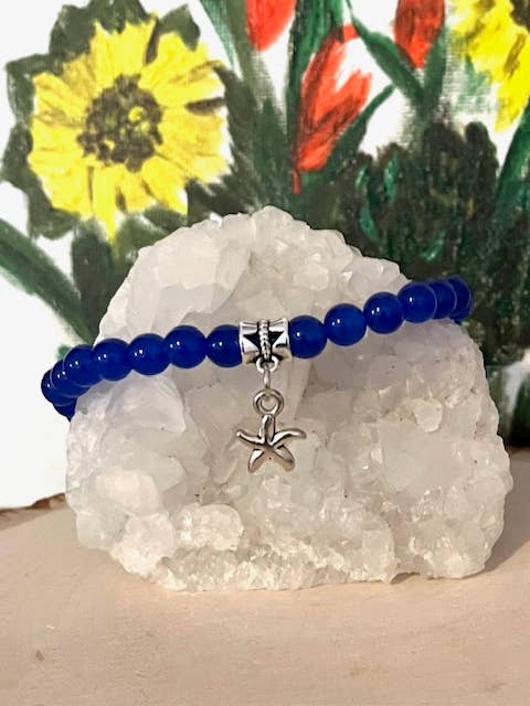 Blue beaded stretch bracelet with small star charm for wholesale by Jewels For Hope