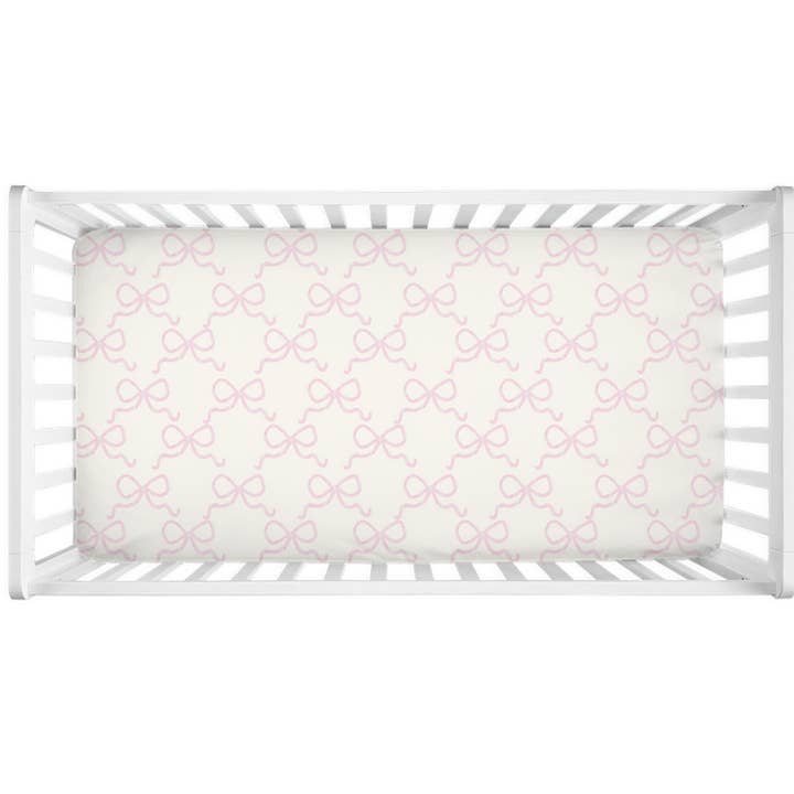 Sæt en bue i det lyserøde krybbe ark for engroshandel hos The Socialite