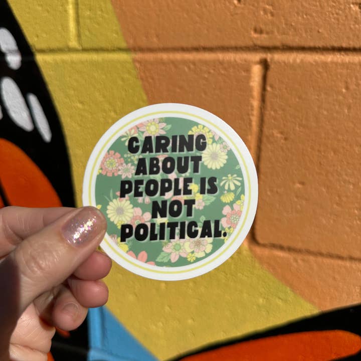 Hilarious Humanitarian - Wholesale Sticker - Caring About People Is Not Political Sticker1