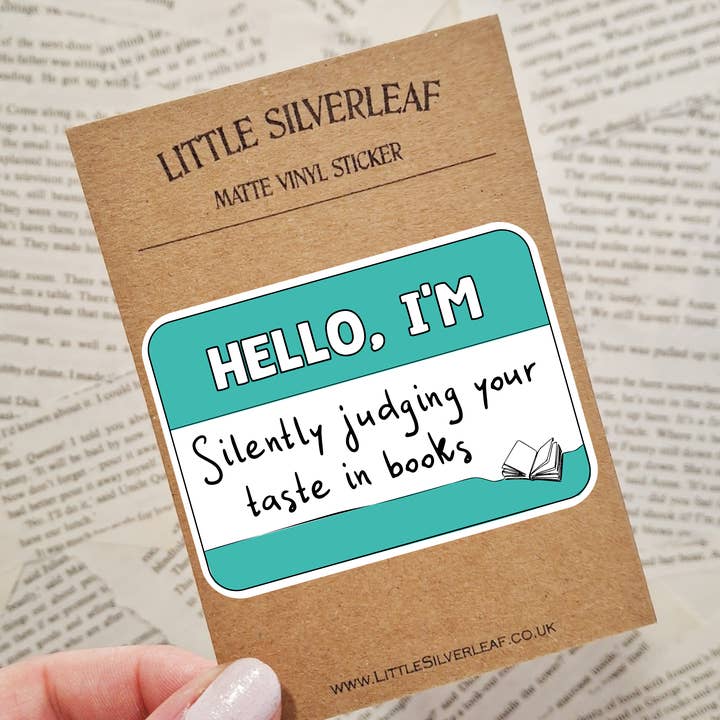 Hello, I'm Silently Judging Your Taste in Books - Bookish Name Tag Matte Vinyl Sticker for wholesale by Little Silverleaf