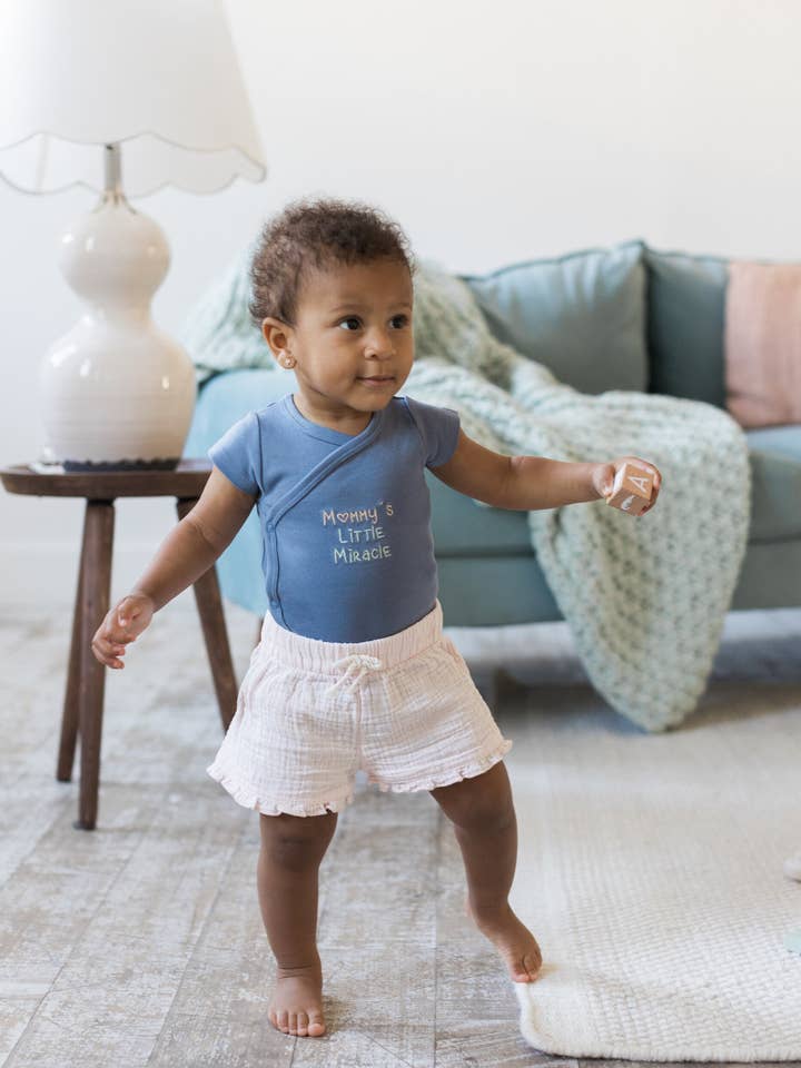 Mommy's Little Miracle Crossbody Onesie for wholesale by Vincent Faith