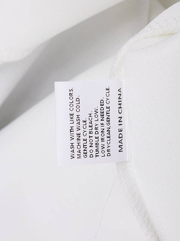 PRETO BRANCO Casaco de gola alta com manga longa, corte solto, estampa floral em cores contrastantes e abertura lateral para venda a revendedores na Faire21