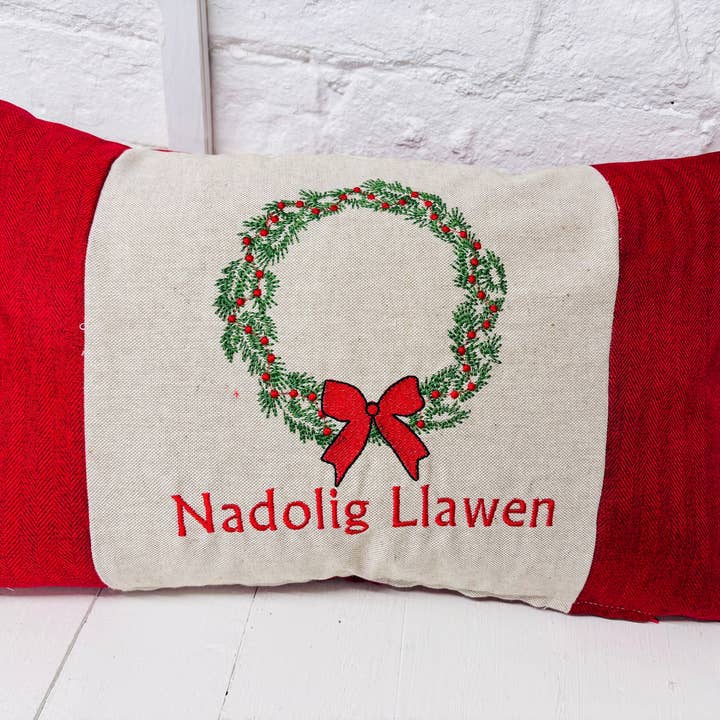 Christmas Wreath Nadolig llawen Red Tweed Cushion . for wholesale by Lizzie Dixon Designs
