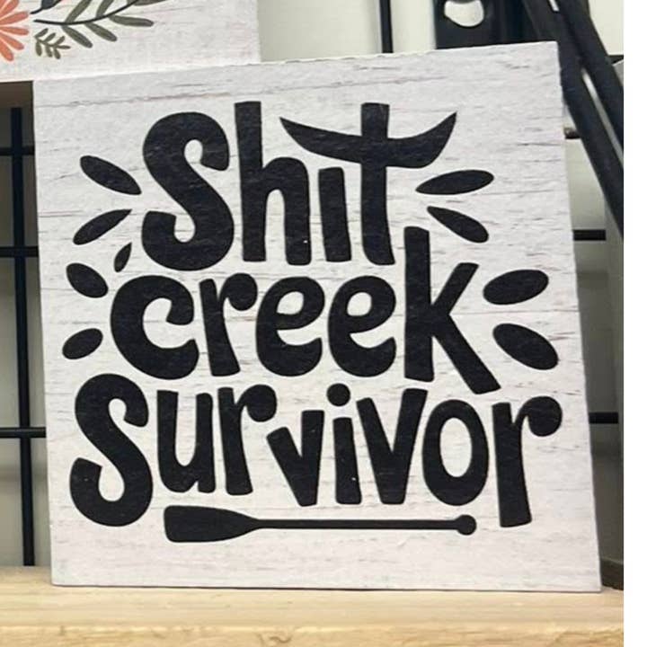 Shit Creek Survivor Funny Sign for wholesale by Kennebug LLC