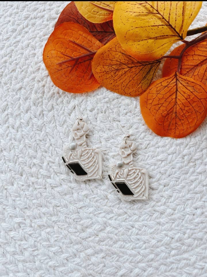 Reading Skeleton Dangles | Clay Earrings | Bookish for wholesale by Bayside Clay