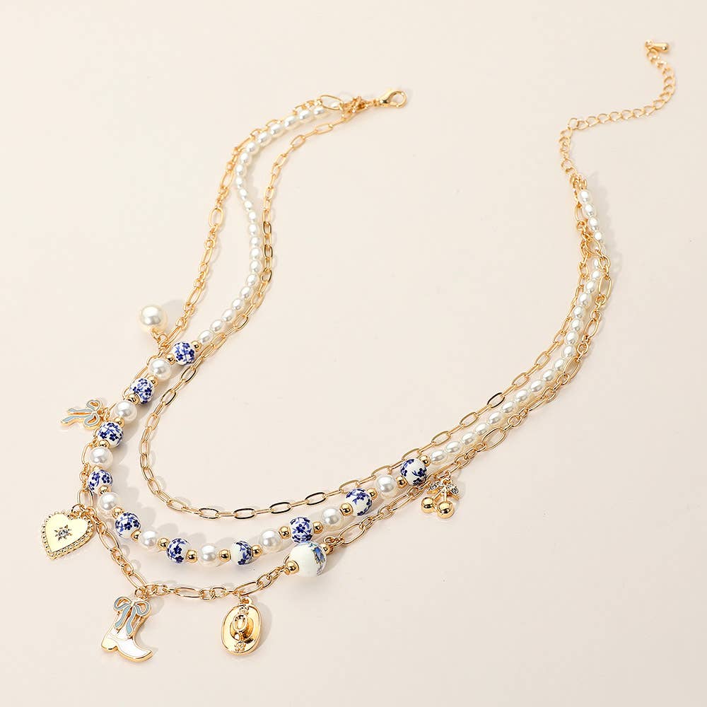 Sensibling Corp. - Wholesale Pendant/Charm Necklace - Western Cowboy Boot Hat Bow Cherry Heart Charm Station Pearl Floral Ceramic Ball Beaded Layered Necklace10