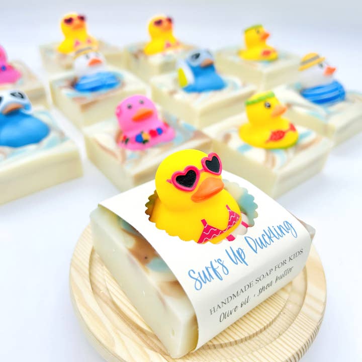 Summer Surf's Up Duckling Handmade Soap Bar for Kids VEGAN and other Purchase Wholesale made in florida. Free Returns & Net 60 Terms on Faire trending on Faire.