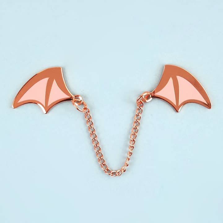 Demon Wings Rose Gold/Light Pink Enamel Pin for wholesale by Flea Circus
